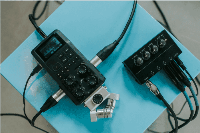 Audio recording equipment connected with high-quality audio cables, showcasing precise audio signal for professional sound setup