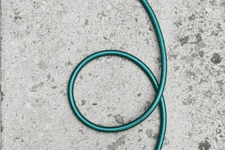Shielded cable suitable for outdoor installations on a concrete surface, illustrating the importance of choosing the right cables for various environments to prevent costly and time-consuming mistakes. Shielded cables minimize EMI, making them ideal for indoor and outdoor settings with high electromagnetic interference