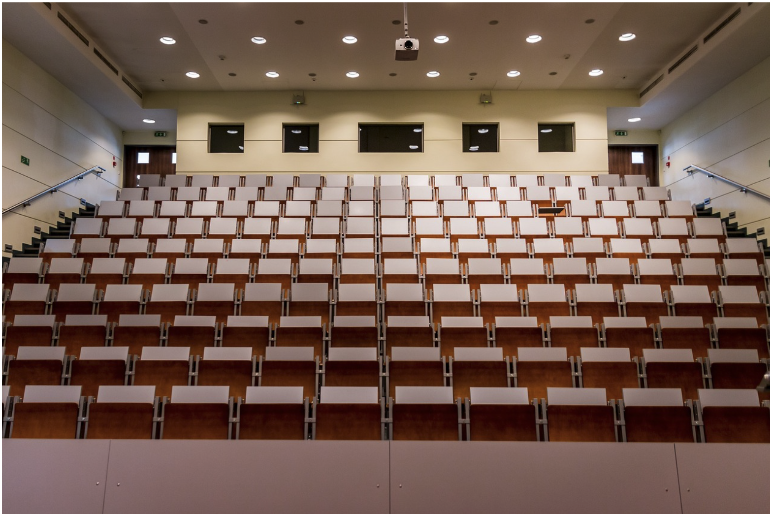 Commercial lecture hall with integrated AV system, illustrating environments where DB9 serial cables support AV control communication between devices