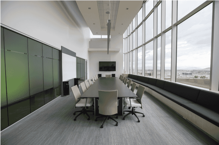 Modern conference room equipped with advanced AV technology, optimized for AXLINK AMX Systems Universal Control, ensuring seamless AV signal distribution with Axlink Plenum control cables, lighting control cables, and AV lighting cables for efficient system integration