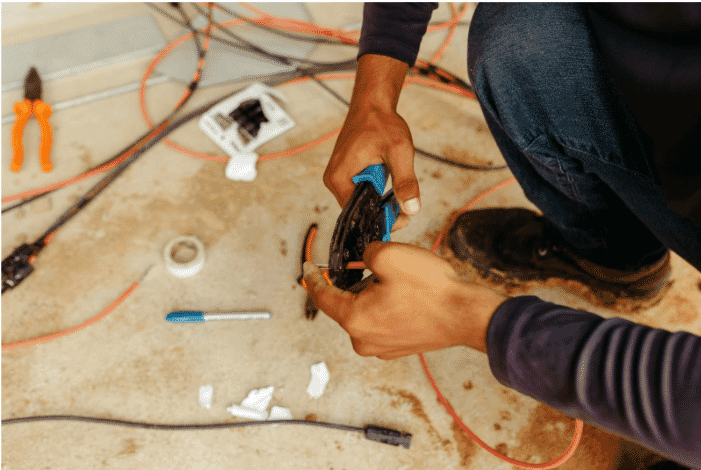 Technician working on building automation cable installation, showcasing smart building cable solutions, low-voltage control cables, and high-efficiency building wiring for automation control and signal distribution in modern construction systems