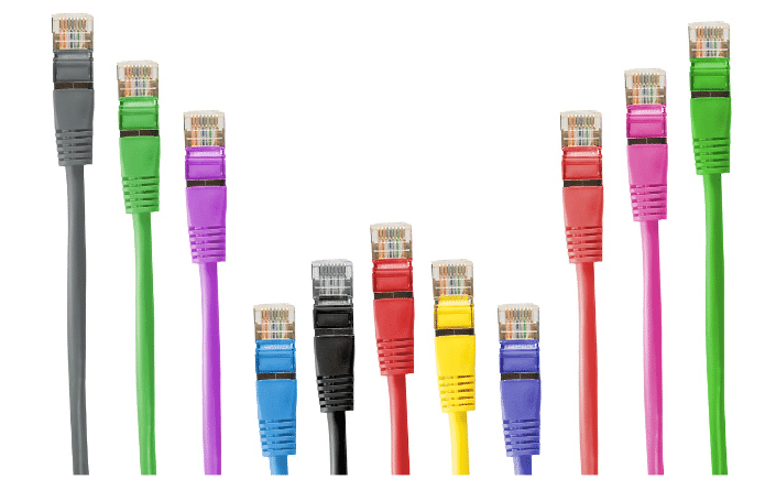 Various colorful RJ45 ethernet cables arranged upright, displaying multiple network cable color codes. These cables are commonly used with ethernet wall jacks and follow a standardized Cat 6 color code. The image showcases a typical Digital Media Cable (Wire) used for networking, which can also be paired with HDMI coax adaptors for different connectivity purposes