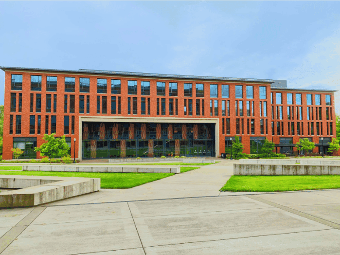 Modern university campus building optimized for security applications with RS485 wiring and RS232 cabling, featuring voltage RS485 infrastructure for long-distance, multi-device connectivity and RS232 TTL cable for reliable access control within short ranges
