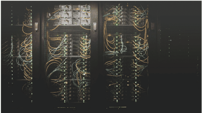 A high-performance server rack with an intricate network of low-latency cables designed for real-time audio and video transmission