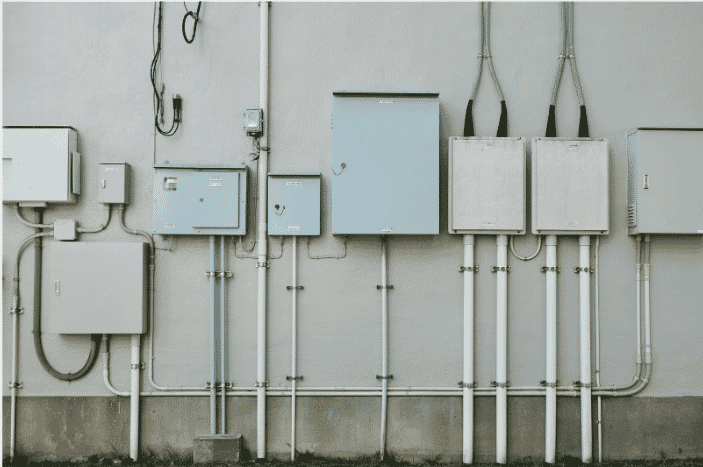 Energy management cables in a structured building automation system on an industrial wall. This setup optimizes energy efficiency by connecting HVAC, lighting, and security systems through high-performance building wires, enabling real-time data flow and energy monitoring in commercial and industrial facilities
