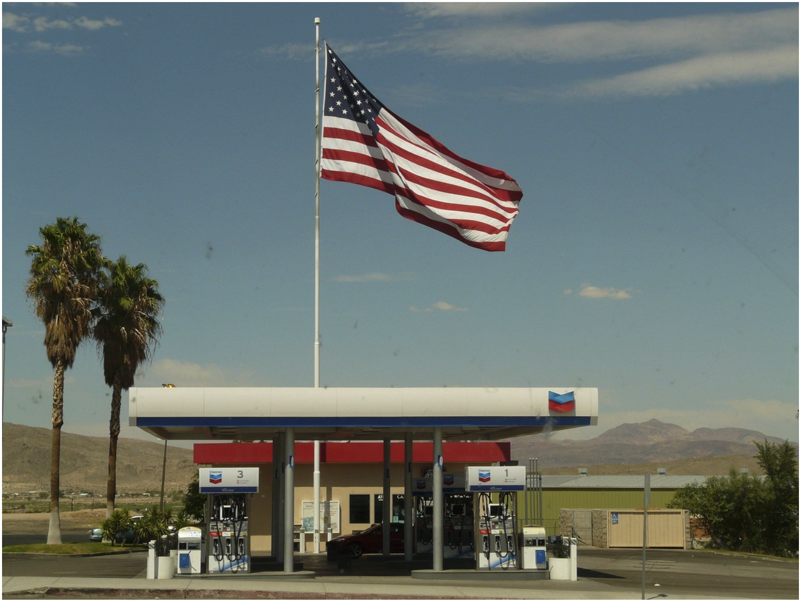 Gas station fuel dispensers with payment terminals, illustrating EMV migration and the role of cable infrastructure in secure CRIND system communication