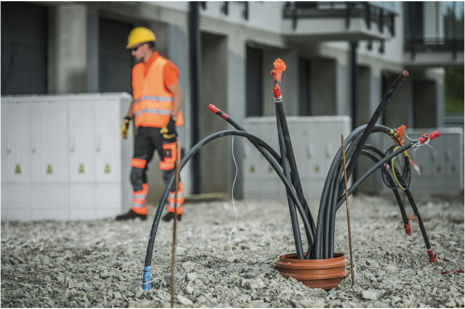 Underground network cable installation at commercial site, illustrating outdoor Ethernet and direct burial cable environments where sealed connectors protect the signal path