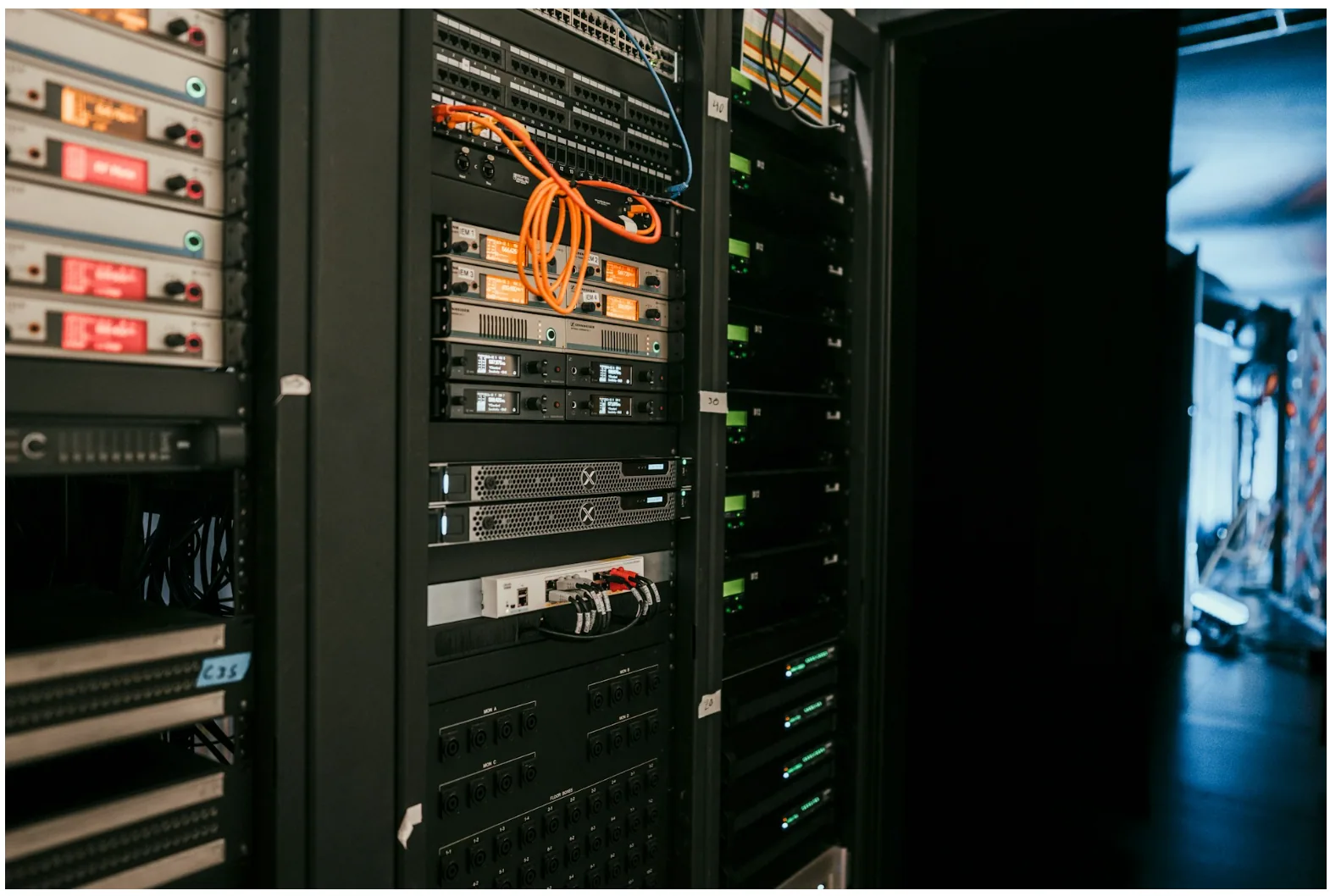 Commercial AV equipment rack with connected control systems, illustrating how control cable supports communication between audio, video, and automation platforms