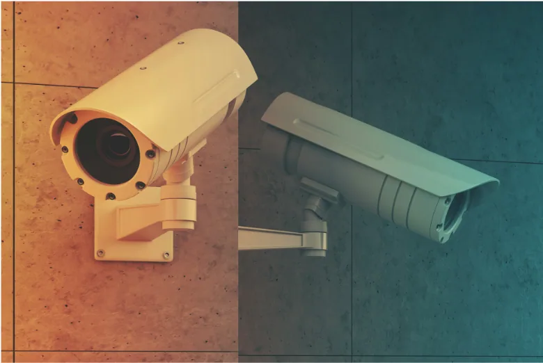Two CCTV bullet cameras mounted on a wall, the type of security cameras connected using Cat5e or Cat6 camera wire