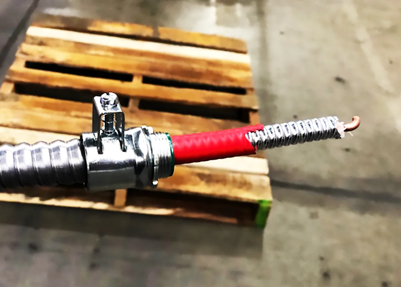 Aluminum‑armored SmartGUARD cable with connector—mechanical strength like conduit, ready for field routing