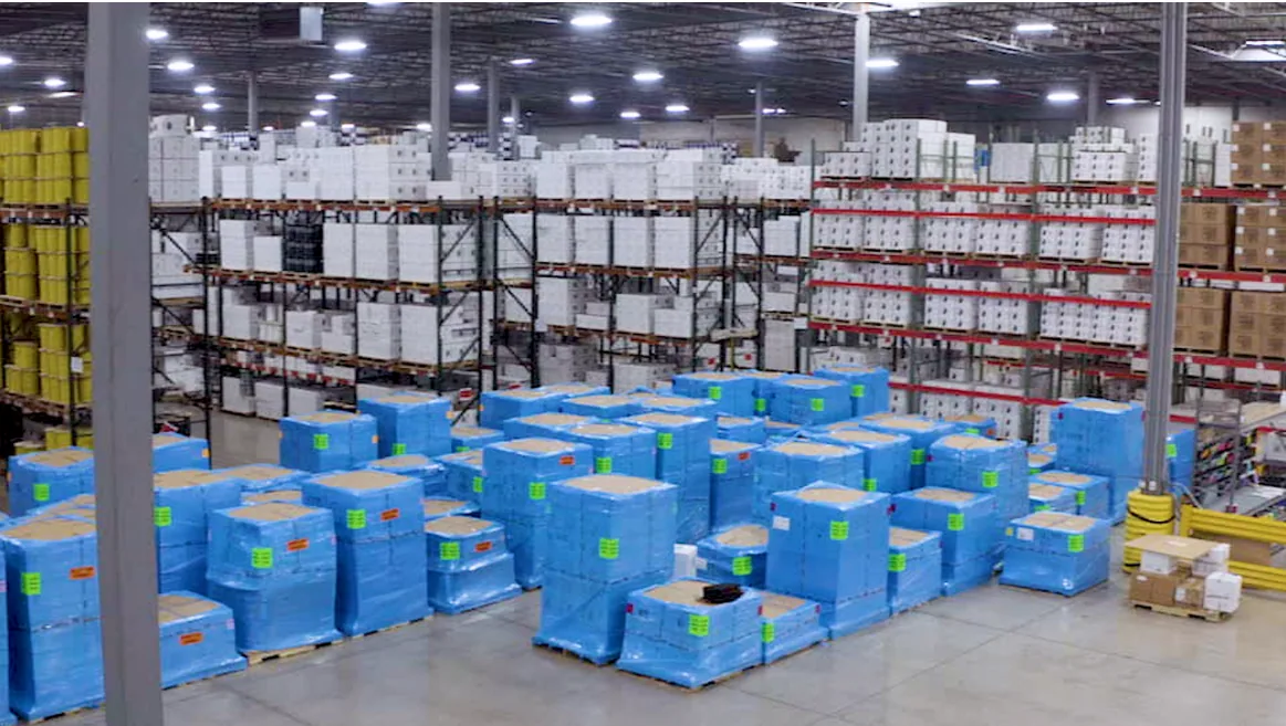 Windy City Wire warehouse with blue-wrapped pallets and stocked cable racks, staged for quick nationwide shipping